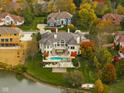 Luxury home with pool and lakefront location in fall at 8804 Waterside Dr, Indianapolis, IN 46278