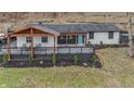 Inviting home exterior with a spacious deck, perfect for enjoying the serene surroundings at 1749 N Blue Bluff Rd, Martinsville, IN 46151