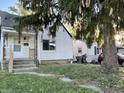 White house with yard and tree at 3919 E 34Th St, Indianapolis, IN 46218