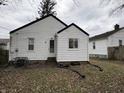 Rear view of house with yard at 3919 E 34Th St, Indianapolis, IN 46218