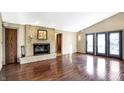 Bright living room featuring hardwood floors and fireplace at 11 Bennett Rd, Carmel, IN 46032