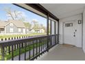 Covered front porch with black railing offers a relaxing outdoor space at 1176 Udell St, Indianapolis, IN 46208