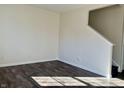 Empty living room with dark wood-look flooring and neutral walls at 8428 Gates Corner Dr, Camby, IN 46113