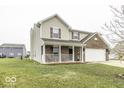 Charming two-story home with a covered front porch and an attached garage at 2386 Blackberry Ct, Greenwood, IN 46143