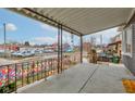 Covered front porch with metal railings and street view at 133 N East St, Greenfield, IN 46140