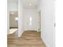 Bright entryway with light wood flooring and neutral walls at 202 Asbury Dr, Anderson, IN 46013