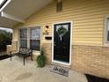 Inviting front door with wreath and decorative mat at 2130 N Cherry St, Columbus, IN 47201