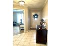 Bright entryway with tile flooring and view of bedroom at 316 Northpointe Ct, Danville, IN 46122