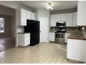 Modern kitchen with white cabinets and stainless steel appliances at 11224 Fall Dr, Indianapolis, IN 46229