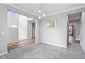 Bright dining room with gray walls, gray carpet, and access to other rooms at 16222 Browning Ct, Fishers, IN 46037
