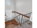 Staircase with metal railing leading to the upper level at 207 Maplebrook Dr, Brownsburg, IN 46112