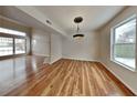 Bright dining room with hardwood floors and large windows at 6221 Boulder Dr, Anderson, IN 46013