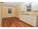 Kitchen with granite countertops and white cabinets at 3322 N Whittier Pl, Indianapolis, IN 46218