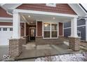 Covered front porch with brick columns and recessed lighting at 3923 Holly Brook Dr, Westfield, IN 46062