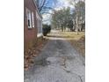 Long driveway leading to the house with mature trees at 5251 Michigan Rd, Indianapolis, IN 46228