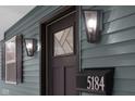 Modern front door with black shutters and sleek lighting at 5184 N Vance St, Columbus, IN 47201