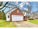 Brick and siding two-story house with attached garage and landscaped yard at 8863 Gardenia Ct, Noblesville, IN 46060