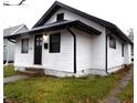 White house with black accents and a small lawn at 1314 Arrow Ave, Anderson, IN 46016
