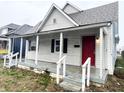 One-story home with a covered porch and gray siding at 2134 Pleasant St, Indianapolis, IN 46203