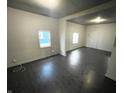 Bright living room with dark floors and access to other rooms at 2134 Pleasant St, Indianapolis, IN 46203