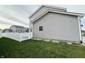 Side view of a two-story house with white vinyl fence at 5128 Macaferty St, Plainfield, IN 46168