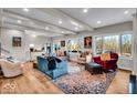 Bright living room with hardwood floors, comfortable seating, and large windows at 2222 E 75Th St, Indianapolis, IN 46240