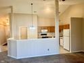 Open concept kitchen with oak cabinets and breakfast bar at 7254 Broyles Ln, Indianapolis, IN 46217
