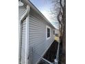 Side of gray house with a chain link fence at 1510 E Gimber St, Indianapolis, IN 46203
