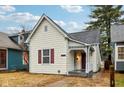 Charming renovated cottage with a welcoming front porch at 2521 Prospect St, Indianapolis, IN 46203