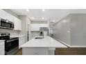 White cabinets, stainless steel appliances, and quartz countertops at 336 Bluestem Ln, Whiteland, IN 46184