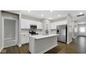 Modern kitchen with white cabinets and island at 336 Bluestem Ln, Whiteland, IN 46184