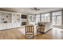 Spacious living room with built-in shelving, fireplace, and hardwood floors at 11624 Horizon Ct, Fishers, IN 46037