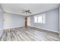 Spacious living room with hardwood floors and bay window at 1641 Manhattan Ave, Indianapolis, IN 46241