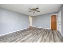 Living room with hardwood floors and ceiling fan at 1641 Manhattan Ave, Indianapolis, IN 46241