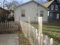 Home features a fenced backyard with a concrete patio at 317 N Bradley Ave, Indianapolis, IN 46201