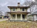 Renovated craftsman home with a metal roof and front porch at 3563 Carrollton Ave, Indianapolis, IN 46205