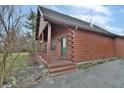 Side view of log cabin home with wooden deck at 5360 N Carroll Rd, Indianapolis, IN 46235