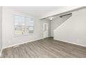 Spacious living room with hardwood floors and large window at 6927 Park Grove Blvd, Whitestown, IN 46075