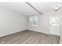 Bright living room featuring wood-look floors and neutral walls at 6927 Park Grove Blvd, Whitestown, IN 46075