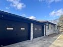 Two-car garage with dark-colored doors and stone accents at 816 N County Road 900 E, Avon, IN 46123