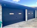 Two-car garage with dark-colored doors and stone accents at 816 N County Road 900 E, Avon, IN 46123