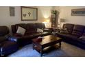 Relaxing living room with brown leather furniture and a coffee table at 816 N County Road 900 E, Avon, IN 46123