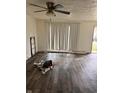 Living room with vinyl flooring and a sliding glass door at 8434 Meadowlark Dr, Indianapolis, IN 46226