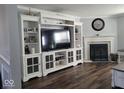 Living room featuring built-in shelving and fireplace at 4548 Copper Grove Dr, Indianapolis, IN 46237