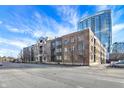 Modern brick building with city skyline in the background at 355 E Ohio E St # 324, Indianapolis, IN 46204