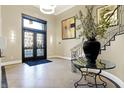 Elegant lobby with ornate staircase, large vase, and modern lighting at 355 E Ohio E St # 324, Indianapolis, IN 46204