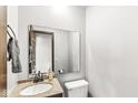 Small bathroom with single sink and toilet at 409 Lansdowne Rd, Indianapolis, IN 46234