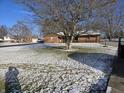 Ranch house with snow covered lawn and trees at 2610 N 350 W, Anderson, IN 46011