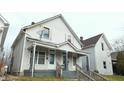 Two-unit building, light gray siding, front porches, and steps at 604 Lincoln St, Indianapolis, IN 46203