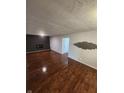 Spacious living room with hardwood floors and a fireplace at 6805 E County Road 100 S, Avon, IN 46123